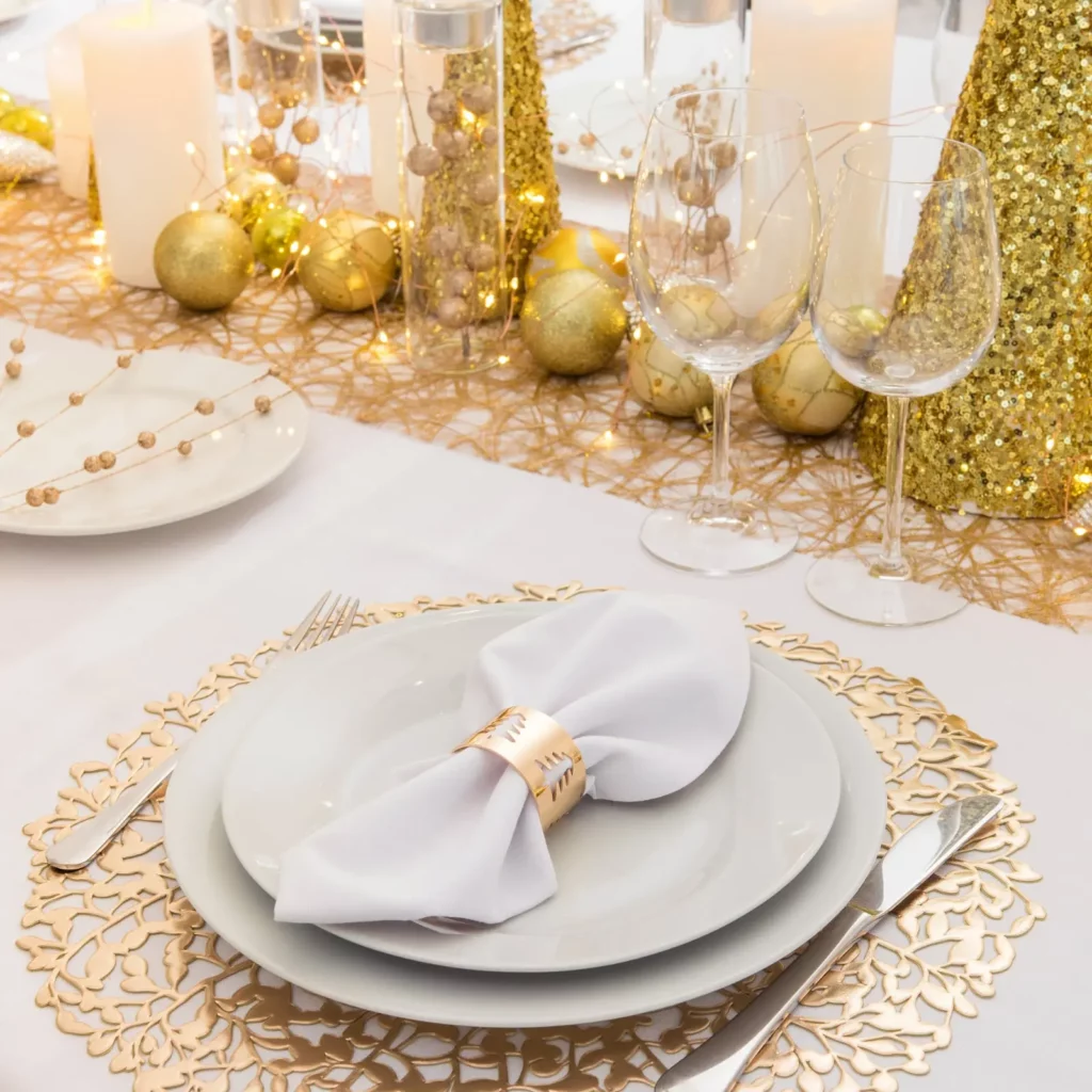 Elegant festive table setting with gold.