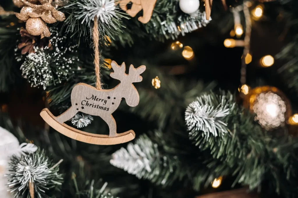 Wooden reindeer ornament on Christmas tree