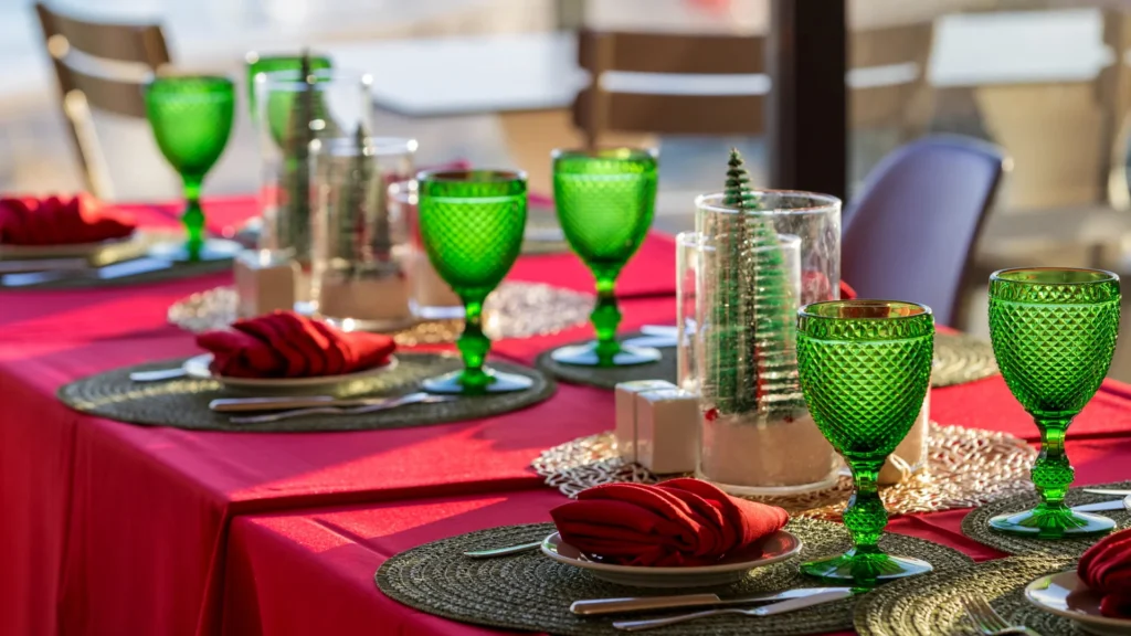 Festive table setting with green glassware